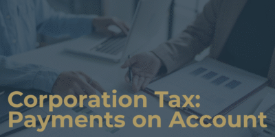 There are 2 people sitting with laptops and accounting information and the text on the image says corporation tax payments on account