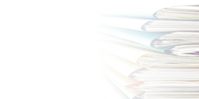 a picture of colours files and papers stacked on top of eachother to represent filing accounts with companies house filing changes