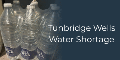 a picture of 6 plastic bottles full of water that have been distributed locally because of the tunbridge wells water shortage